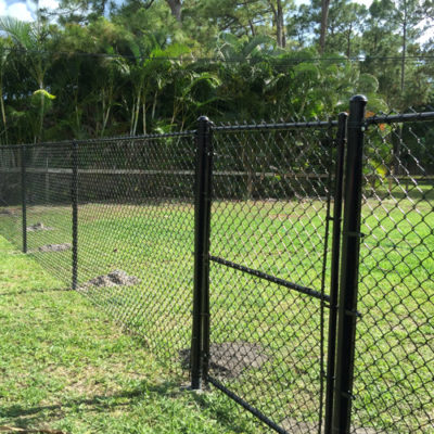 6 ft. black vinyl chain link fence with walk gate.